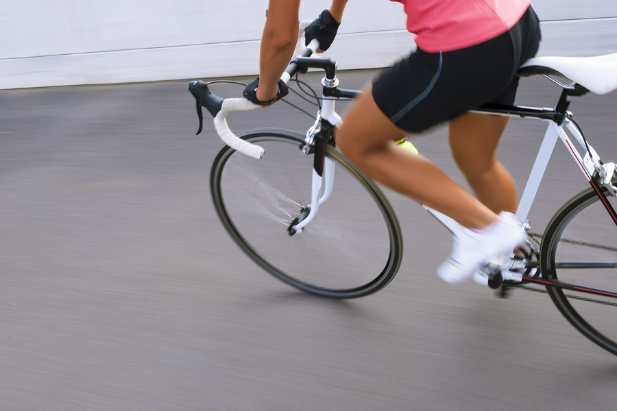 Female Cyclist Making Excercise On Race Bike. Image With Panning